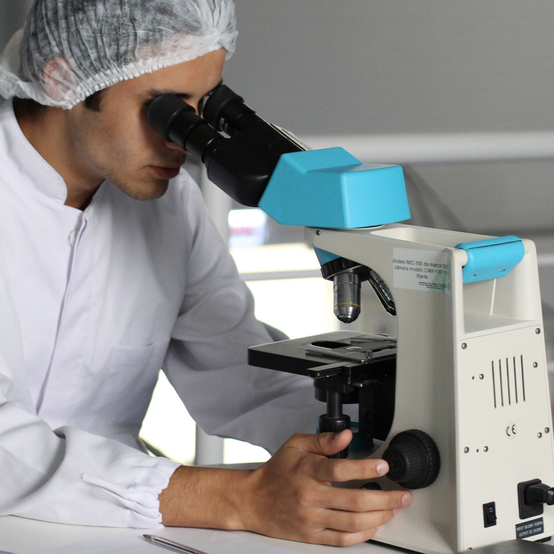 Photo of a man looking in a medical device